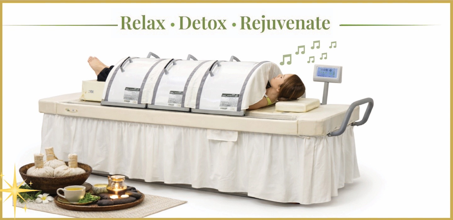 Person relaxing inside an infrared sauna for wellness and detoxification.